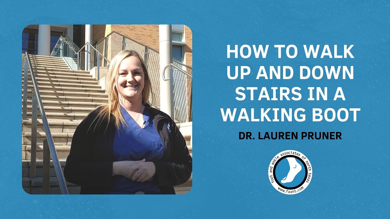 How do you walk up and down stairs with a walking boot?