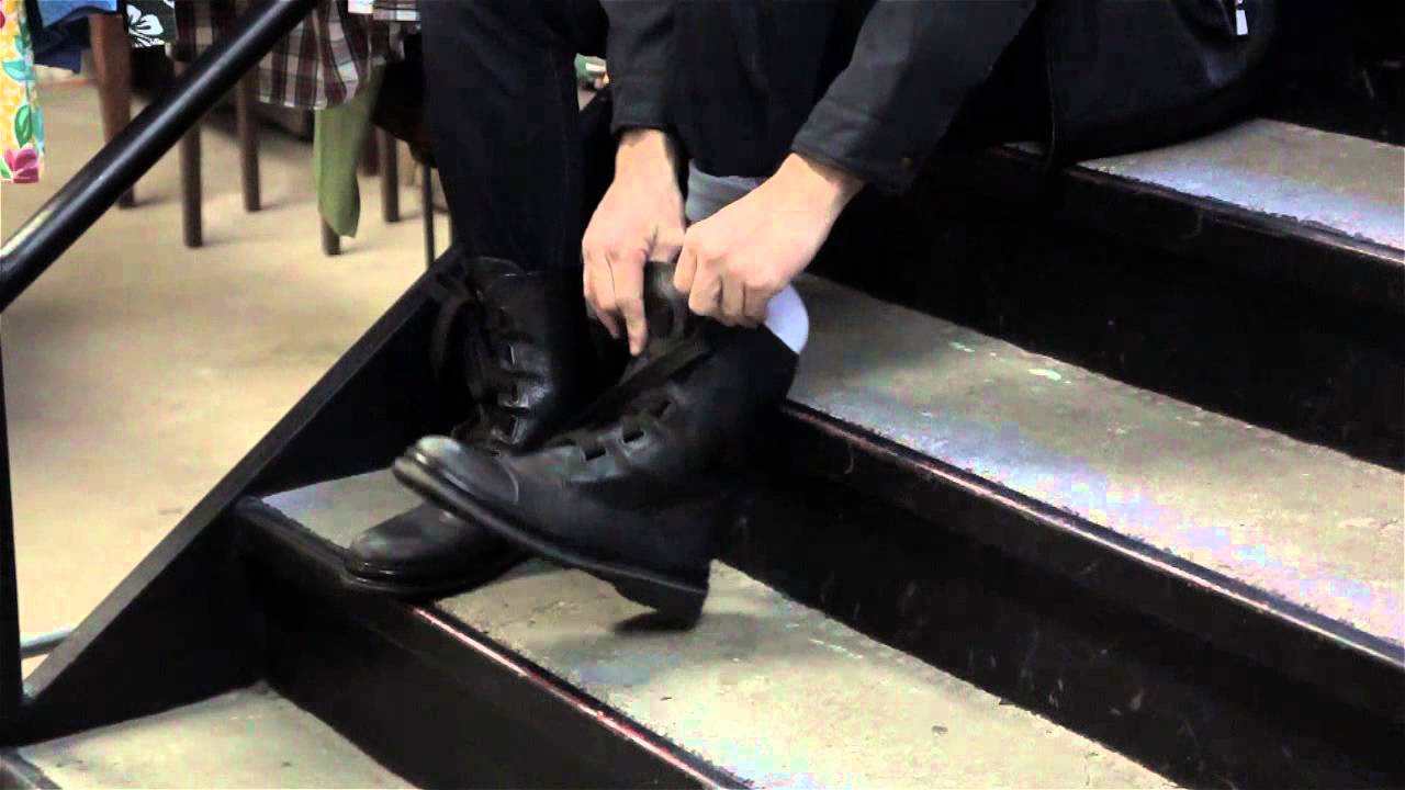 How do you tuck mens jeans into boots?