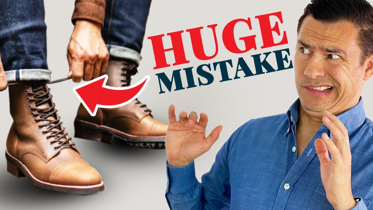 How should men wear boots with jeans?