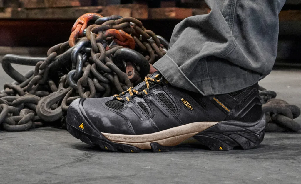 Close-up of durable work shoes on a floor.