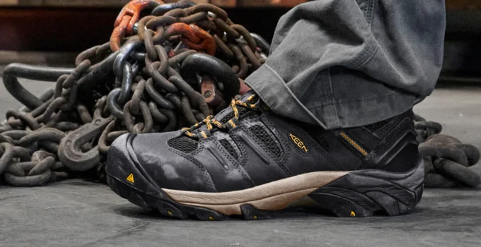 Close-up of durable work shoes on a floor.