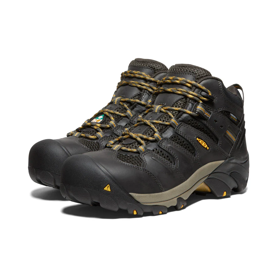 Durable hiking boots in black with yellow accents.