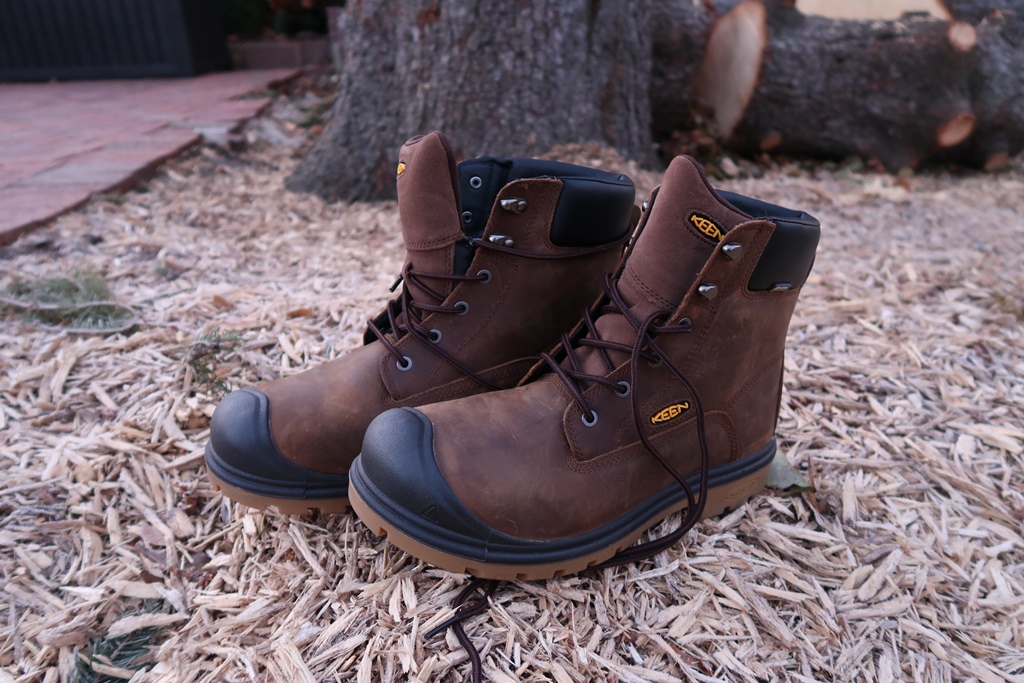 Brown leather boots on a natural outdoor surface
