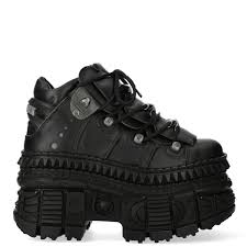 Stylish black platform shoes with unique design.