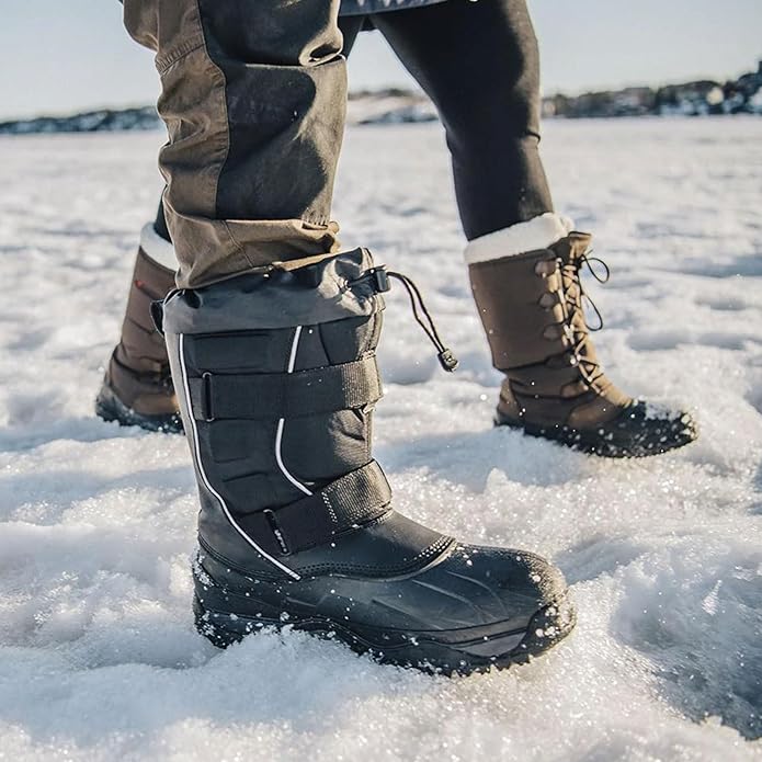 Two individuals wearing winter boots in snow.