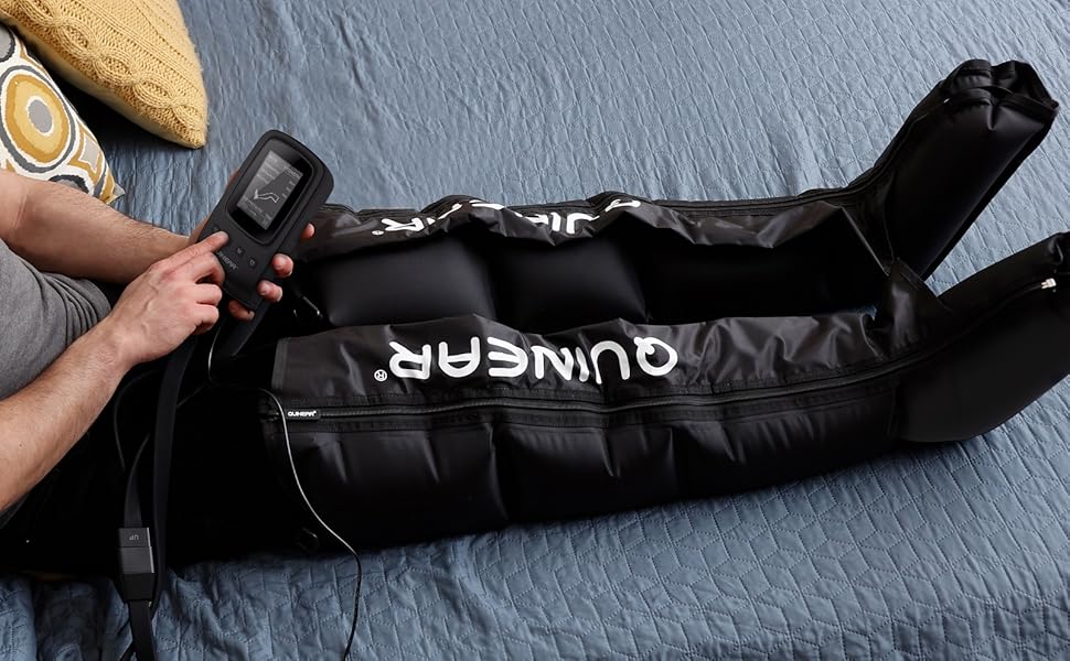Person using pneumatic leg compression device on bed.