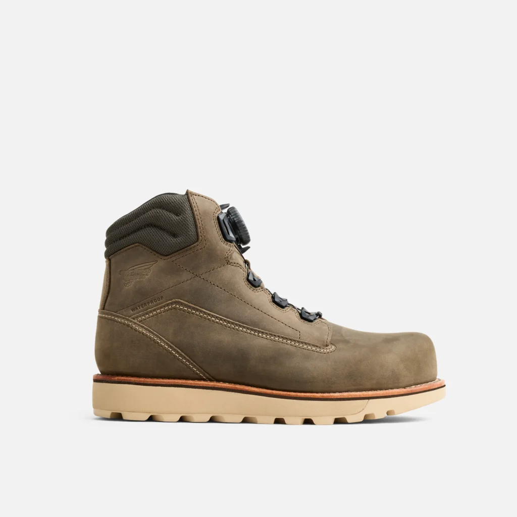 Waterproof brown hiking boot with durable sole.