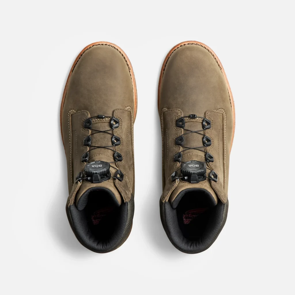 Brown hiking shoes with laces and durable design.