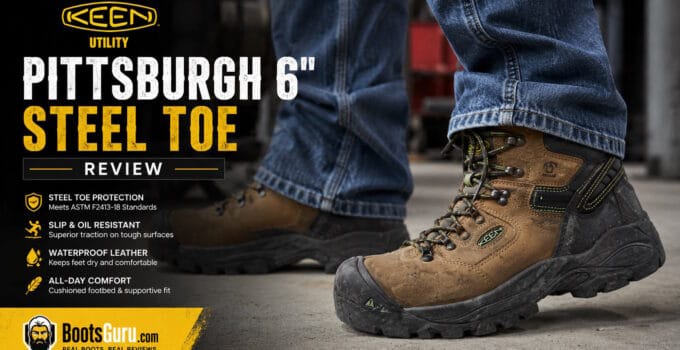 Close-up of KEEN Utility Pittsburgh 6-inch steel toe work boots worn by a person standing on a workshop floor, highlighting durability and safety features.