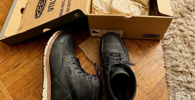 KEEN Utility San Jose 6 inch alloy toe work boots in black with white wedge soles next to the KEEN Utility box