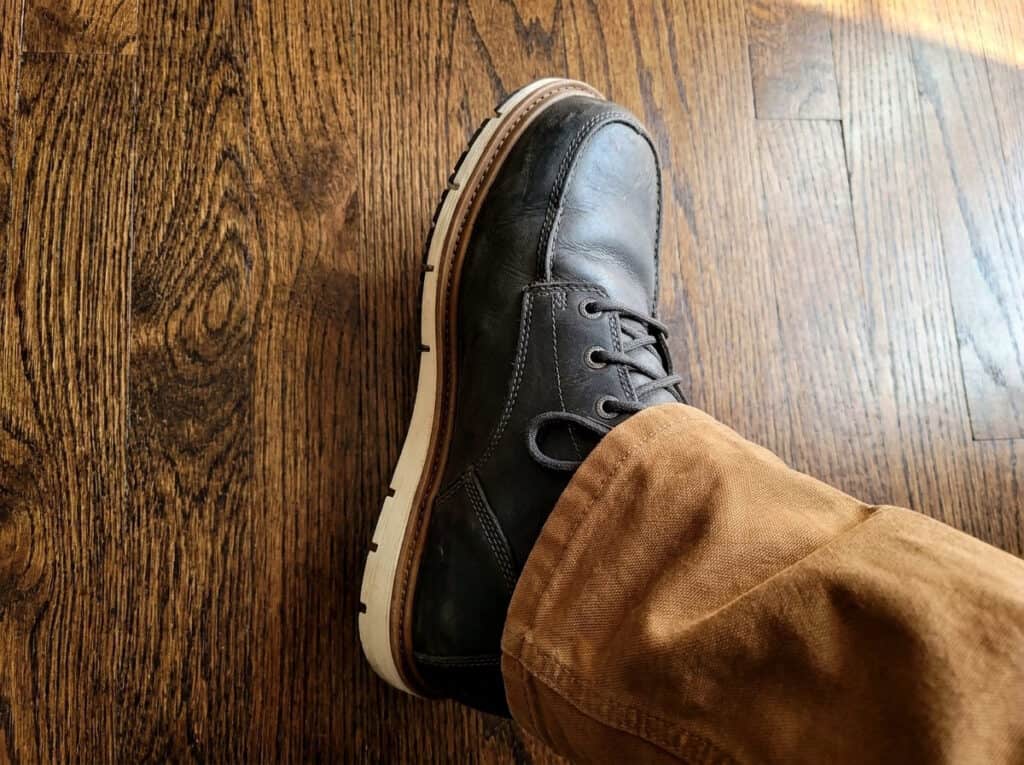 Side view of a KEEN Utility San Jose boot showing the leather upper and white wedge sole