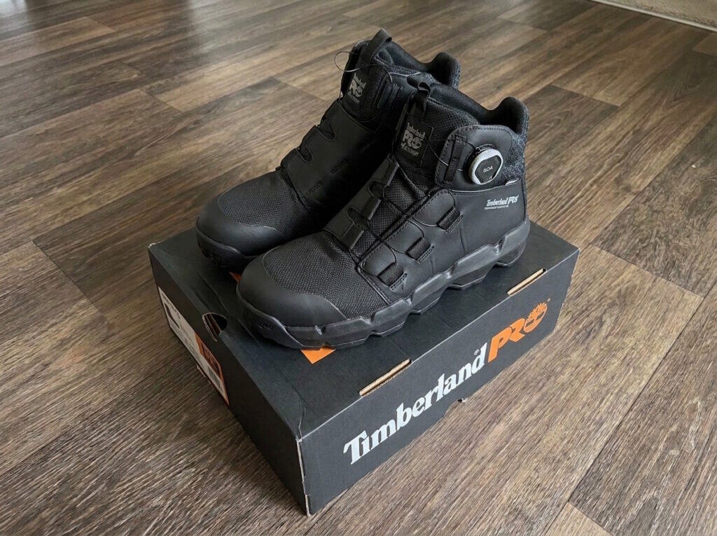 Black Timberland PRO Morphix BOA 6 inch composite toe boots standing on the Timberland PRO box