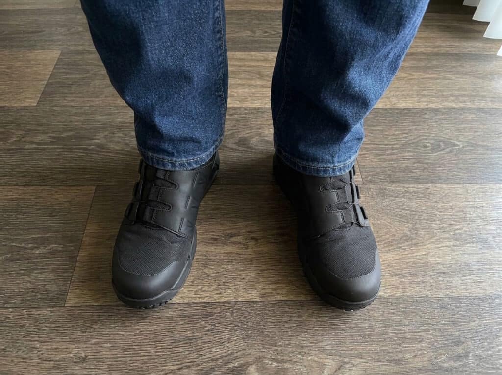Front view of Timberland PRO Morphix BOA boots worn with jeans on a wood floor
