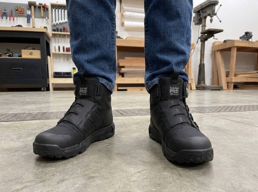 Timberland PRO Morphix BOA boots worn on a concrete floor in a woodworking shop