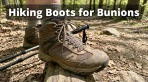 Close-up of a sturdy hiking boot on a forest trail, suitable for bunions and wide feet, emphasizing comfort and support for outdoor activities.
