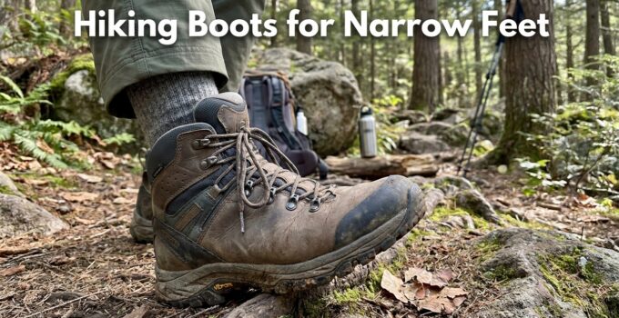 Close-up of a hiking boot on a trail in a forest, highlighting narrow fit and sturdy design for hiking enthusiasts.