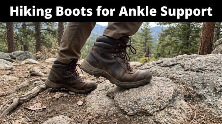 Close-up of hiking boots on rocky trail with trees in background, emphasizing ankle support for outdoor hiking.
