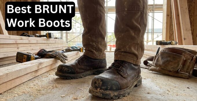 Close-up of rugged BRUNT work boots on a construction site with tools and wooden planks in the background.